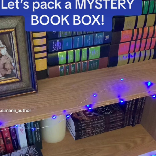 Packing a mystery book box with swag, 3 limited edition signed paperbacks, and 1 full-size gift item. All items will be the author's choice.